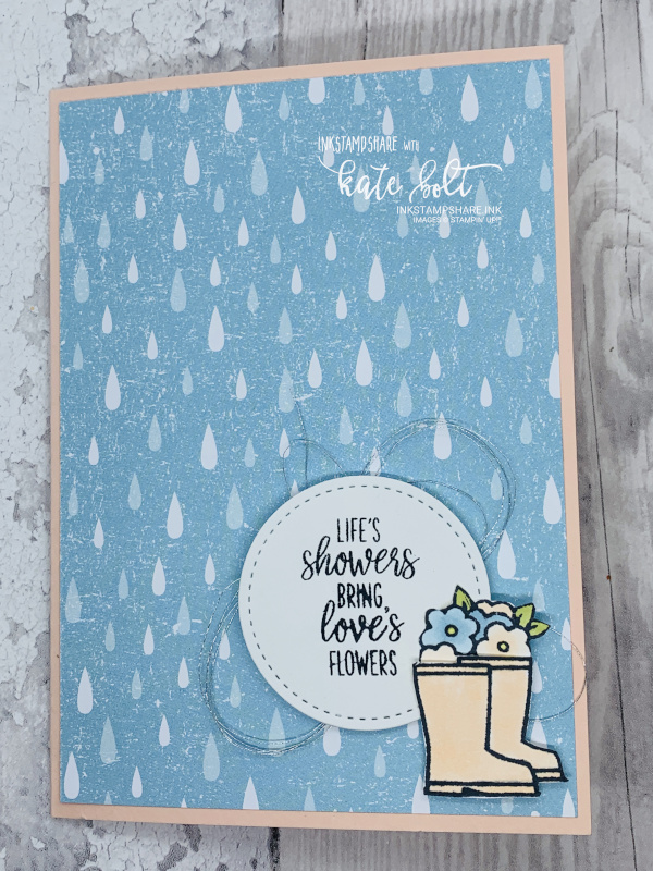 Under My Umbrella Card for the stampers showcase blog hop. Card with raindrops, welly boots with flowers in and  the sentiment Life's showers brings loves flowers.