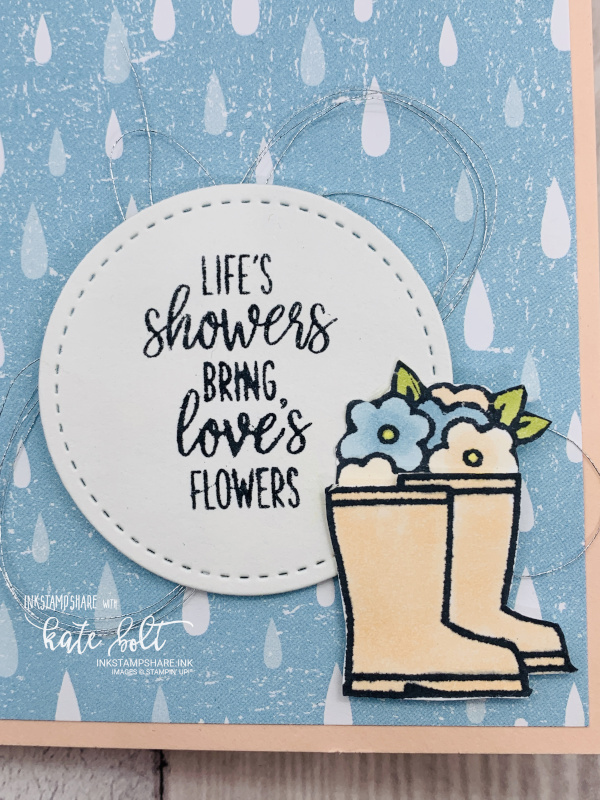 Card with rain drops and  pretty welly boots and  flowers