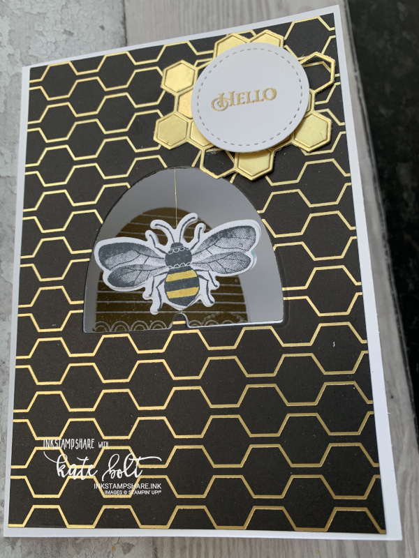 Honey bee spinner card for the Inspire Create Challenge #063 movement theme. Gold and  black card featuring a spinning bee in a bee hive aperture.