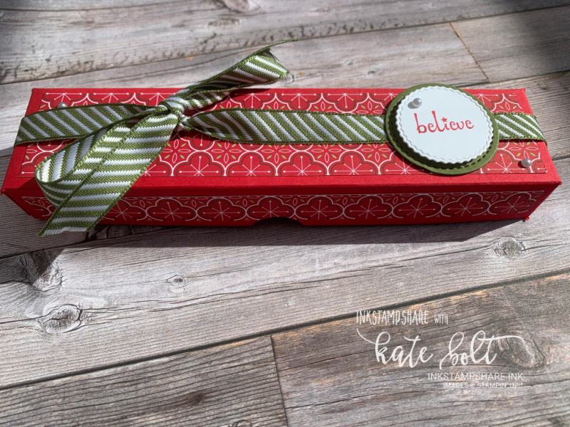 Tealight Christmas gift box using the Heart Warming Hugs Papers in traditional reds and  greens. With Believe stamped and  Mossy Meadow ribbon.