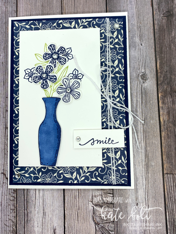 Positive Inkers Blog Hop November. Card in Night Of Navy and  White using the Basket Of Blooms stamp set. The card features a vase of flowers and  says smile.