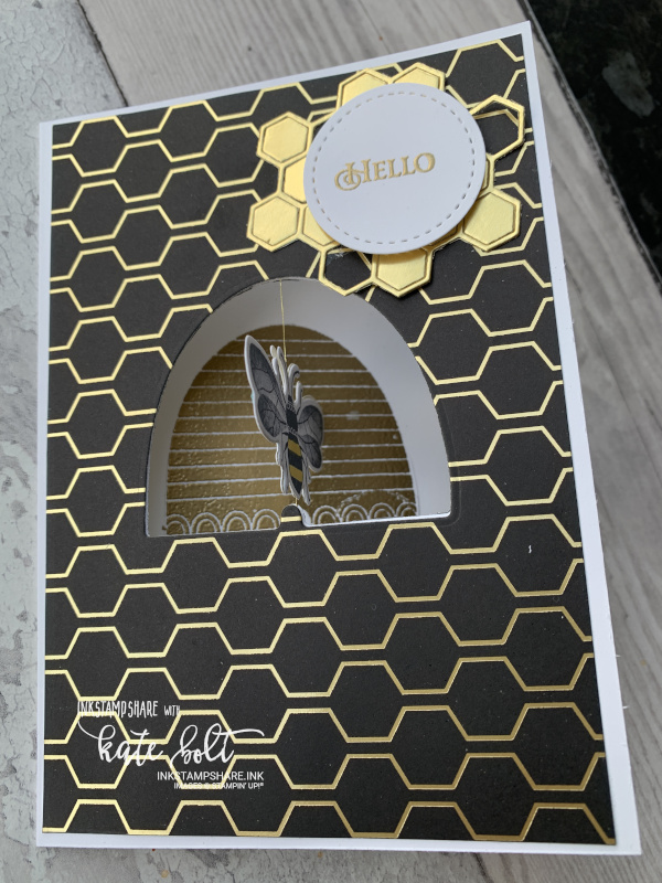 Honey bee spinner card for the Inspire Create Challenge #063 movement theme. Gold and  black card featuring a spinning bee in a bee hive aperture.