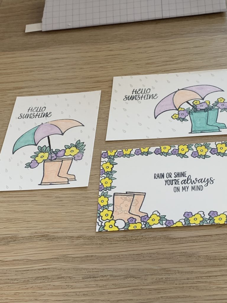 Under My Umbrella card using #simplestamping for Coffee and  Cards. This one had a rain shower, shimmery boots in Coastal Cabana with flowers tumbling out of the top.