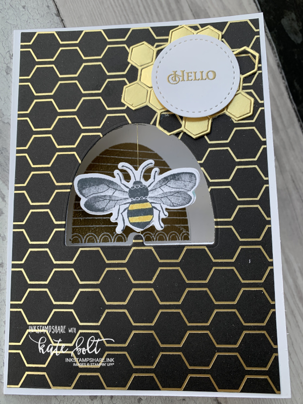 Honey bee spinner card for the Inspire Create Challenge #063 movement theme. Gold and  black card featuring a spinning bee in a bee hive aperture.