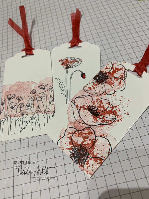 Tags using the scalloped tag topper punch and  the Painted Poppies stamp set. The white ribbon is coloured to match using Poppy Parade Marker.